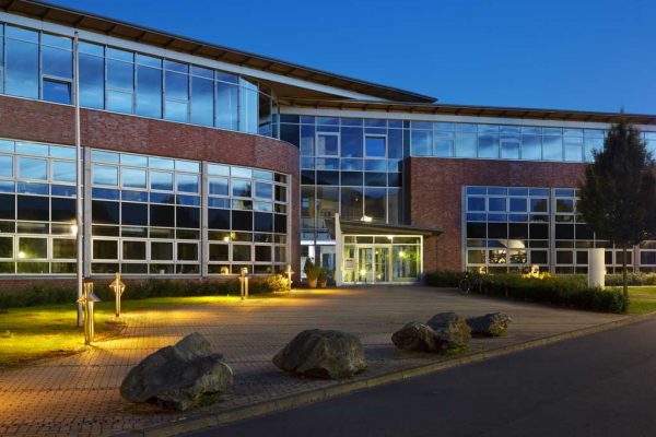 modern-office-building-with-night-blue-sky-PSNDMPR