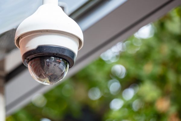 Security concept. Surveillance CCTV Camera on the roof, closeup view